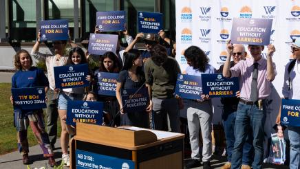 AB 3158 Podium photo with attendees