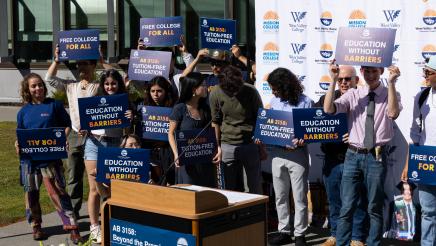 AB 3158 Podium photo with attendees