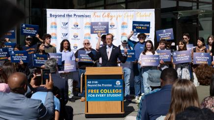 Asm. Berman speaking on the podium with attendees