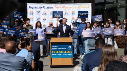 Asm. Berman speaking on the podium with attendees