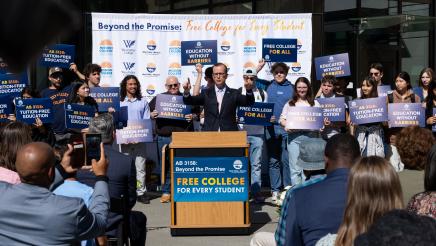 Asm. Berman speaking on the podium with attendees