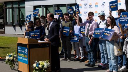 Asm. Berman speaking on the podium with attendees