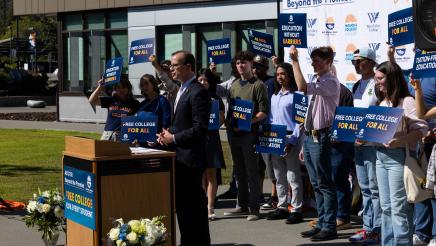 Asm. Berman speaking on the podium with attendees