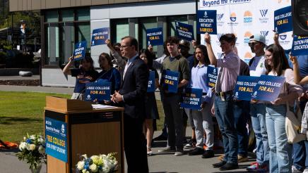 Asm. Berman speaking on the podium with attendees