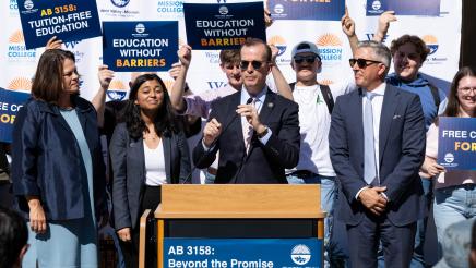Asm. Berman speaking on the podium with attendees