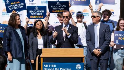 Asm. Berman speaking on the podium with attendees