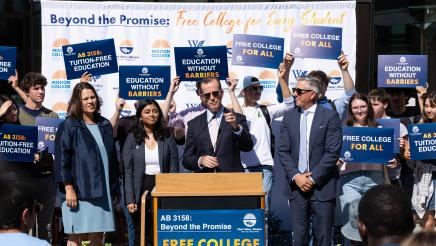 Asm. Berman speaking on the podium with attendees